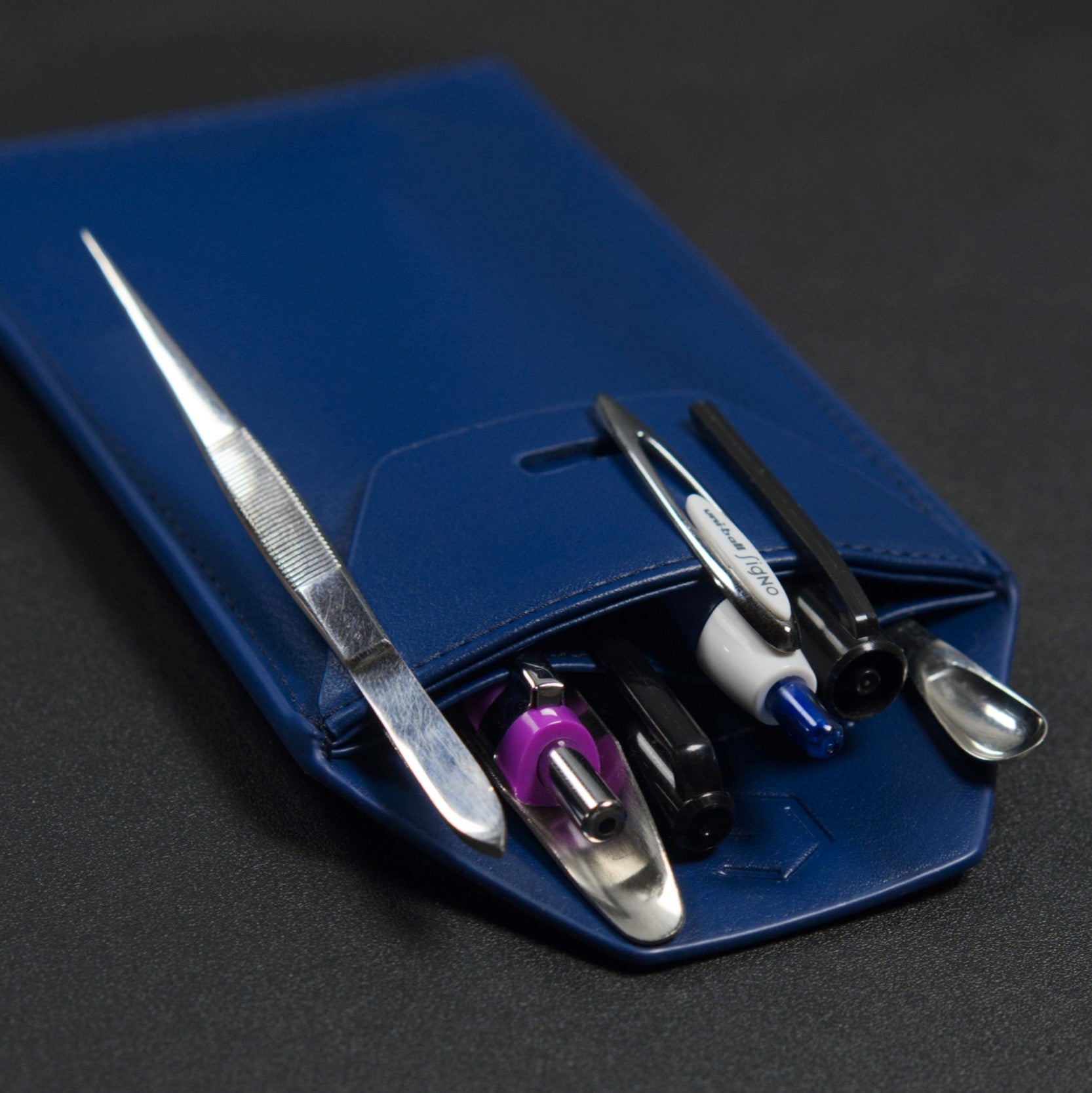 blue pocket protector for chemistry utensils on a black background